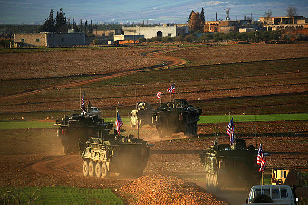 This file photo taken on March 5, 2017 shows a convoy of US forces armoured vehicles driving near the village of Yalanli, on the western outskirts of the northern Syrian city of Manbij. — AFP