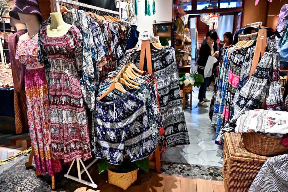 This photo taken on October 4, 2023 shows a shop selling clothing in elephant print at Icon Siam shopping mall in Bangkok. Thailand on February 6, 2024 ordered its ports to keep a close watch out for rogue “elephant pants” being imported to the kingdom, as Bangkok trumpeted its copyright claim to the popular pachyderm print/AFPPix