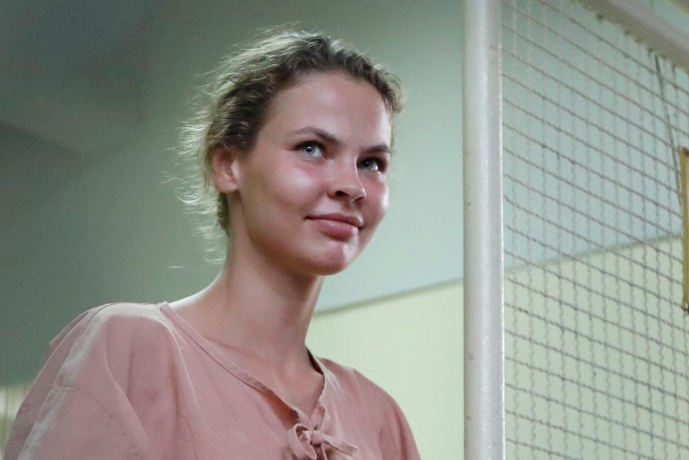 This file photo taken on Aug 20, 2018 shows detained Belarusian model Anastasia Vashukevich better known by her pen name Nastya Rybka, preparing to board a prison van after a court trial in Pattaya, following a police raid on a sex training course. — AFP