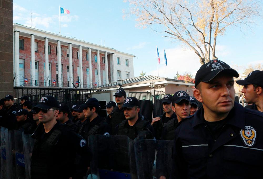 In this file photo taken on November 11, 2016 Turkish riot police stand as protestors demonstrate against France in front of the French embassy in Ankara, on November 11, 2016. AFPpix