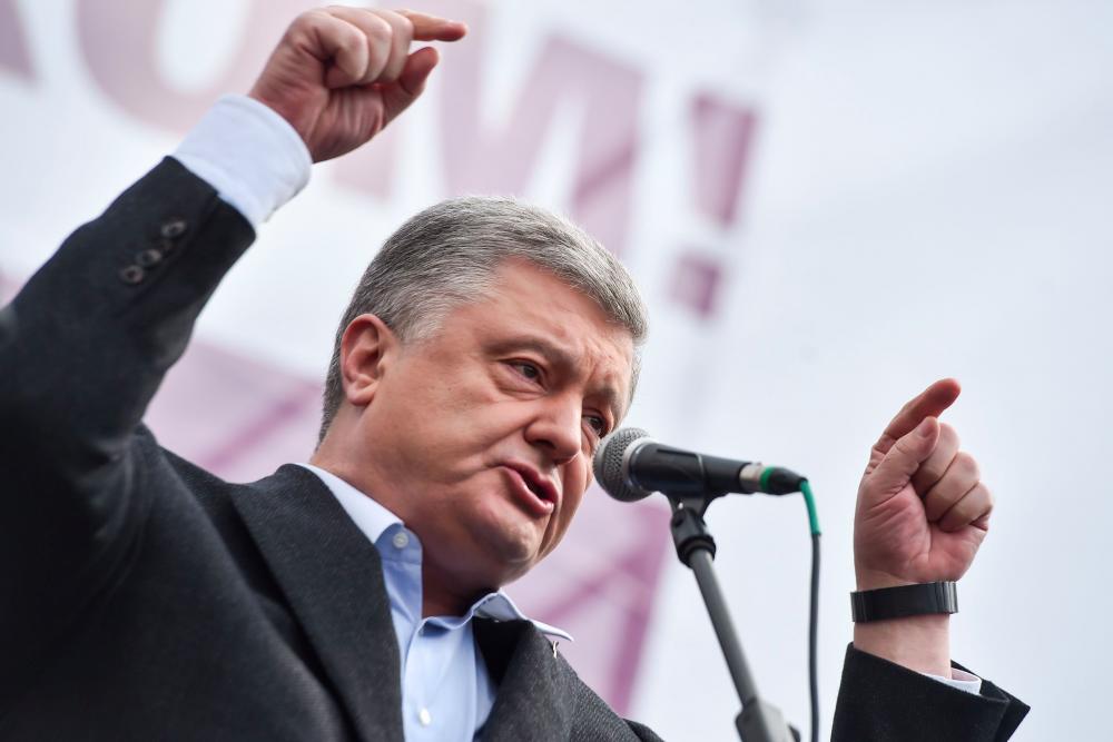 In this file photo taken on April 19, Ukrainian President and then presidential candidate Petro Poroshenko addresses his supporters during a rally in Kiev hours before a stadium debate with his rival, comedian Volodymyr Zelensky. — AFP