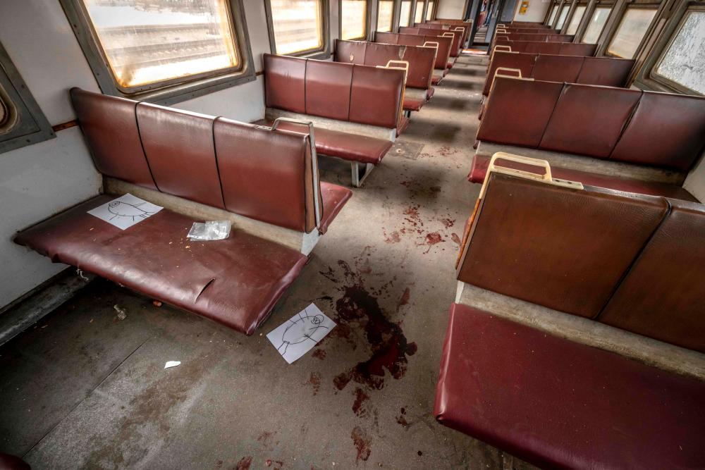 Graphic content / (FILES) In this file photo taken on April 8, 2022, blood stains the floor of a train car that was being used for civilian evacuations, after a rocket attack at a train station in Kramatorsk, eastern Ukraine. AFPPIX