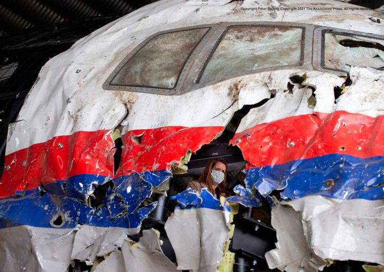 Trial judges and lawyers inspect the reconstructed wreckage of Malaysia Airlines Flight MH17, at the Gilze-Rijen military airbase, southern Netherlands - AFPpix