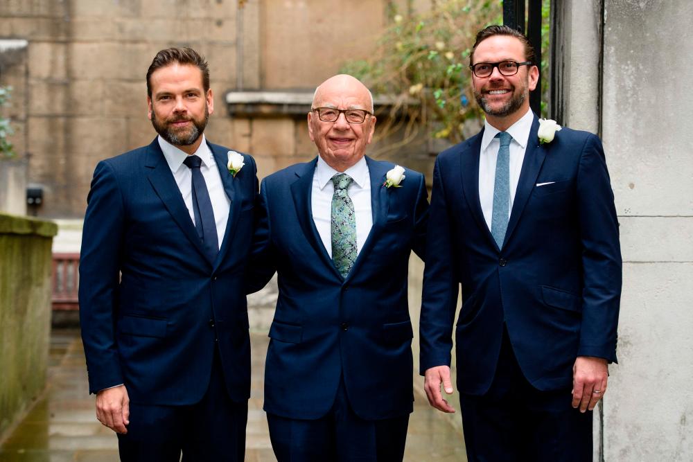 Rupert Murdoch (centre) is flanked by his sons Lachlan (left) and James in this photo taken in March 2016. – AFP