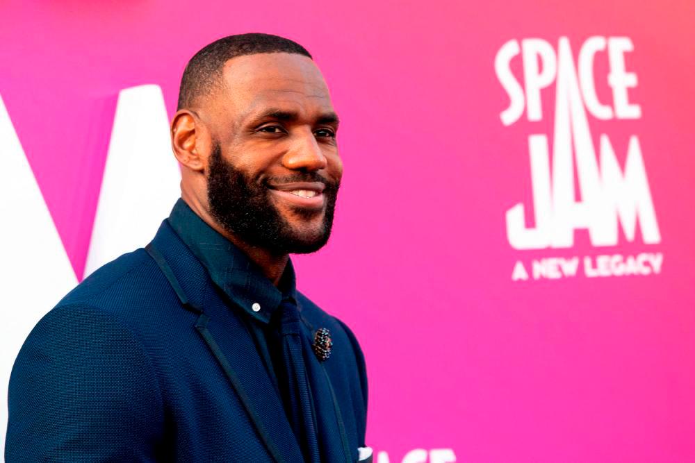(FILES) In this file photo basketball player/actor LeBron James arrives at the Warner Bros Pictures world premiere of “Space Jam: A New Legacy” at the Regal LA Live in Los Angeles, California, July 12, 2021.- AFP