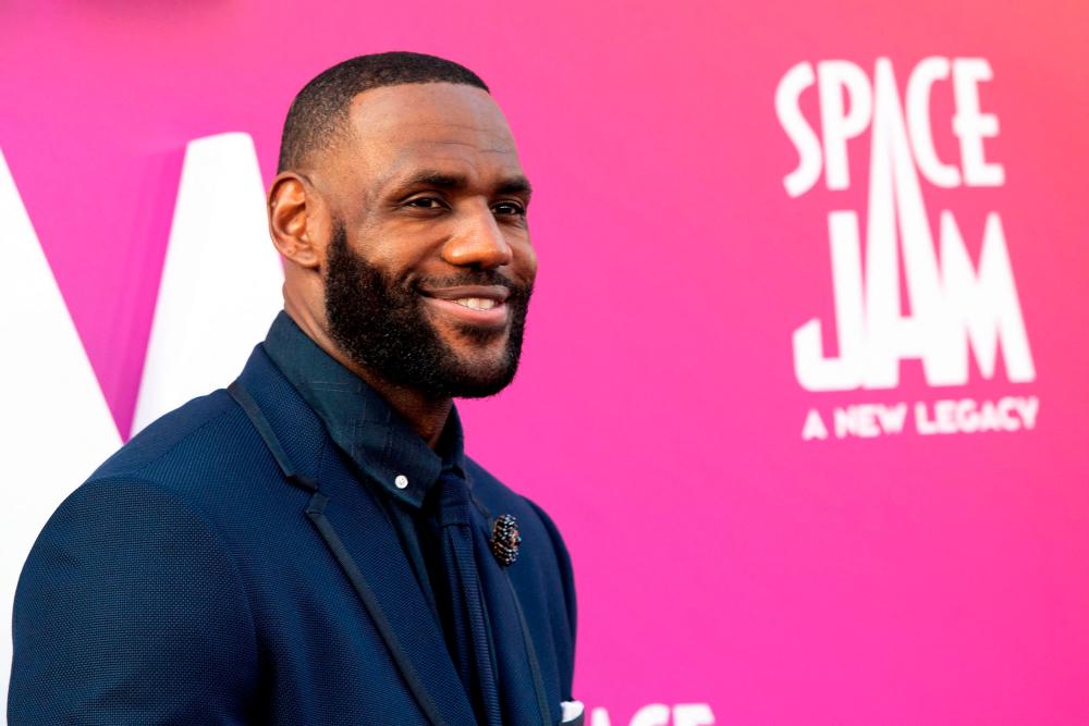 (FILES) In this file photo basketball player/actor LeBron James arrives at the Warner Bros Pictures world premiere of “Space Jam: A New Legacy” at the Regal LA Live in Los Angeles, California, July 12, 2021.-AFP