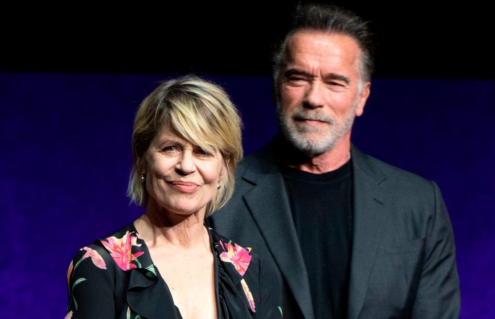 In this file photo taken on April 04, 2019 Actors Linda Hamilton (L) and Arnold Schwarzenegger speak on stage during the CinemaCon Paramount Pictures Exclusive Presentation at the Colosseum Caesars Palace in Las Vegas, Nevada. A smorgasbord of sequels, prequels and reunions from “Terminator” to “Game of Thrones” awaits thousands of misty-eyed comic book geeks and sci-fi nerds descending on San Diego this week for the world’s largest celebration of pop culture fandom. / AFP / VALERIE MACON