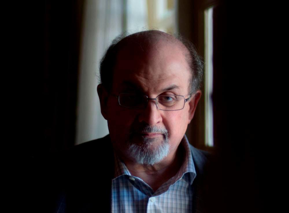 In this file photo taken on April 19, 2013, British author Salman Rushdie, poses for a portrait during ‘Midnight’s Children’ press day on April 19, 2013 in Los Angeles, California. AFPPIX