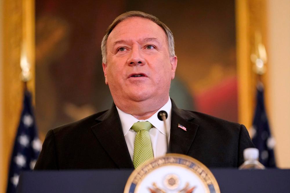 In this file photo US Secretary of State Mike Pompeo speaks during a news conference to announce the Trump administration’s restoration of sanctions on Iran, on Sept 21, 2020, at the US State Department in Washington,D.C. — AFP