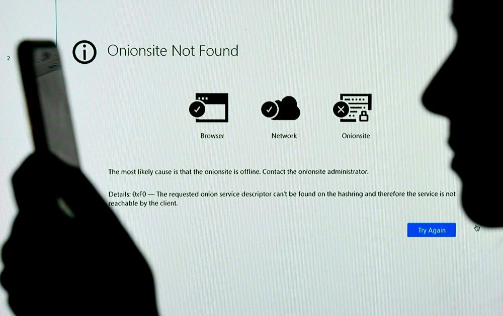 In this file photo illustration taken in Arlington, Virginia, on May 14, 2021, shows a screen displaying the Darkside Onionsite address with a notice saying it could not be found. AFPpix