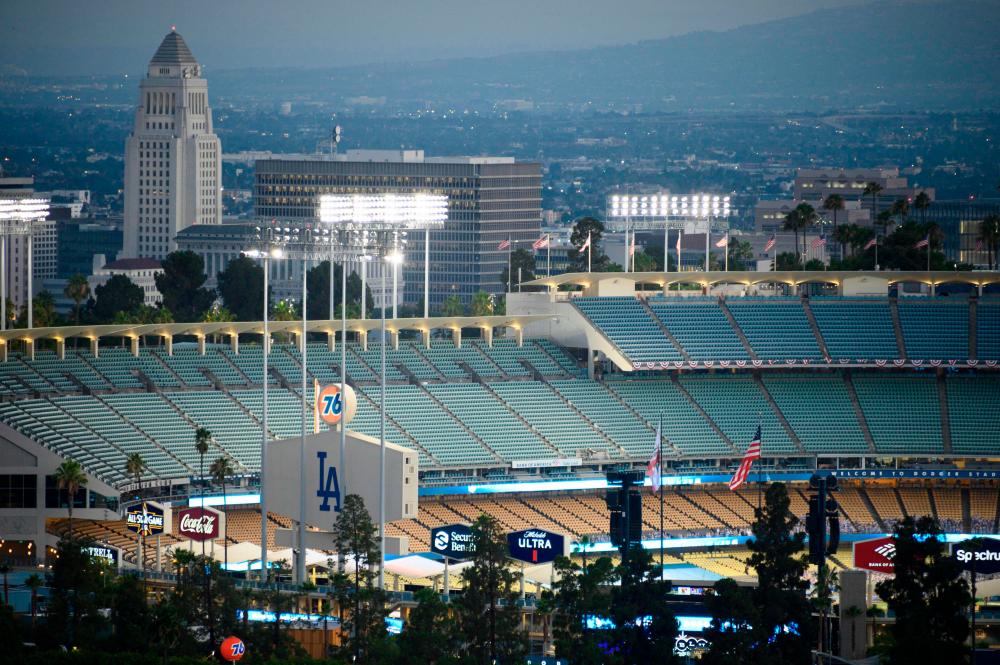 (FILES) In this file photo taken on July 23, 2020 a view of empty seats is seen in Dodgers Stadium as the Los Angeles Dodgers play the San Francisco Giants in an empty stadium on the opening day of the coronavirus-abbreviated Major League Baseball (MLB) season, in Los Angeles. -AFP