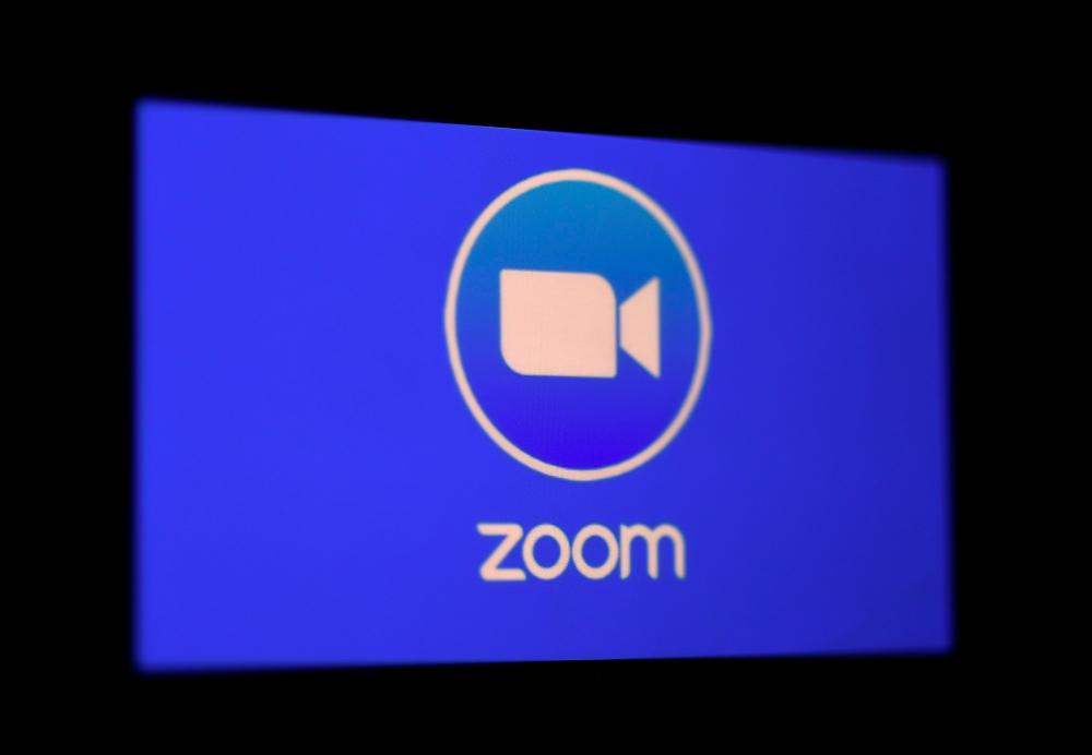 FILES) In this file photo illustration a Zoom App logo is displayed on a smartphone on March 30, 2020 in Arlington, Virginia. / AFP / Olivier DOULIERY