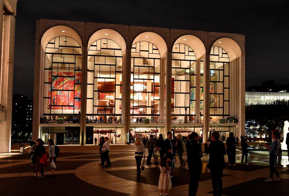 (FILES) In this file photoa view of the Metropolitan Opera at Lincoln Center for the Performing Arts is seen on October 5, 2018 in New York City. / AFP / Angela Weiss