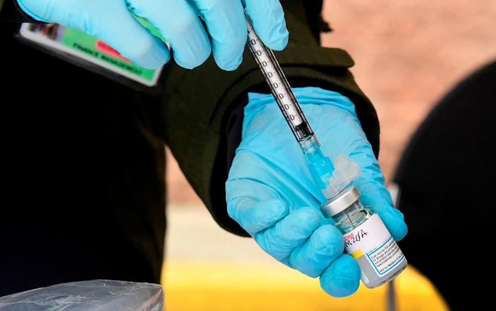 (FILES) The US will begin in mid-March a clinical trial of a version of Moderna’s Covid vaccine specific to the South Africa variant, -AFP