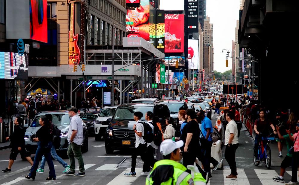 View of a street near Times Square, New York City. New orders for US-made goods increased less than expected in May, fanning fears of an economic slowdown. – AFPpic