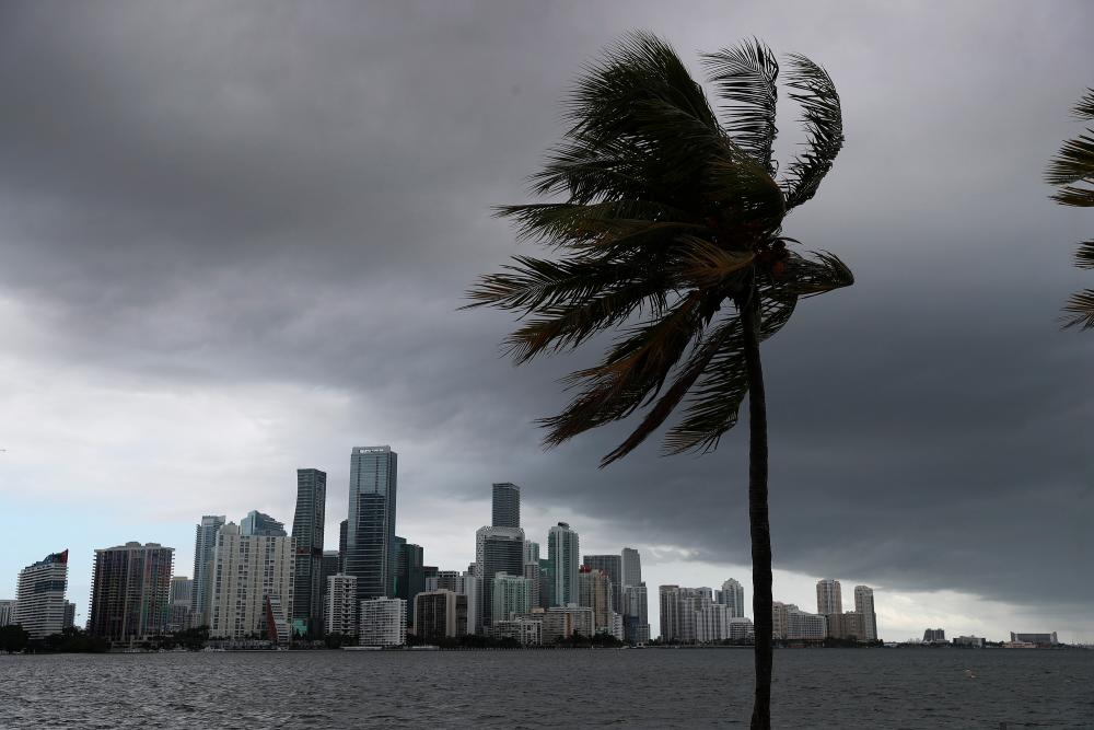 In this file photo taken on Aug 1, 2020 storm clouds are seen over the city as Hurricane Isaias approaches the east coast of Florida in Miami, Florida. — AFP