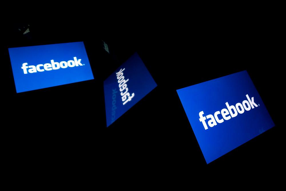 In this file illustration picture taken on February 17, 2019 shows the US social media Facebook logo displayed on a tablet in Paris. Facebook, under pressure to ramp up privacy rules across its platform, said on August 20, 2019 it was rolling out a tool allowing users to control data that it receives from other apps and websites about their online activity. — AFP