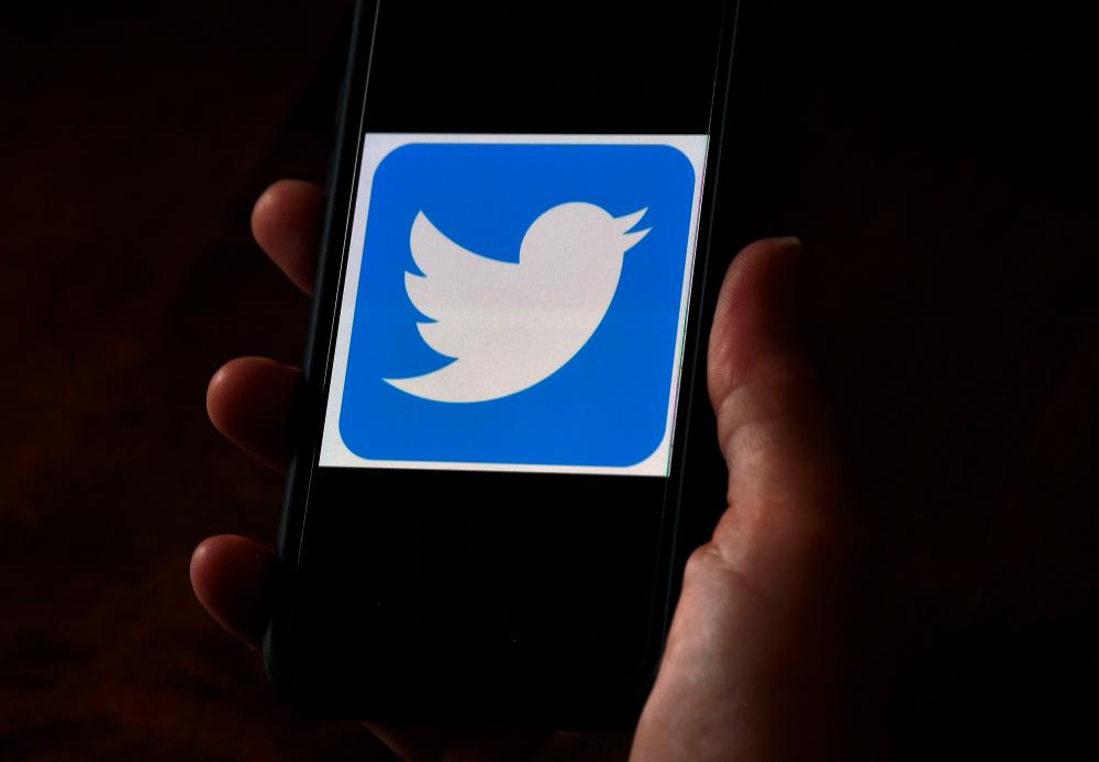 In this file photo illustration, a Twitter logo is displayed on a mobile phone on May 27, 2020, in Arlington, Virginia. — AFP