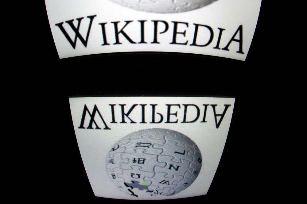 The “Wikipedia” logo is seen on a tablet screen in Paris. Google has agreed to pay Wikipedia for content displayed by its search engine, mirroring deals the US tech giant has struck with news outlets in Europe. AFPPIX