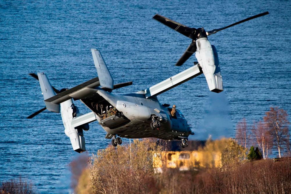 (FILES) In this file photo taken on October 30, 2018 The United States’ V-22 Osprey, a multi-mission, tiltrotor military aircraft with both vertical takeoff and landing, flies during a joint demonstration as part of the NATO Trident Juncture 2018 exercise in Byneset near Trondheim, Norway. AFPPIX