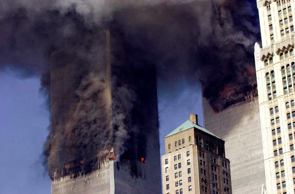 In this file photo smoke billows from the twin towers of the World Trade Center in lower Manhattan, New York on September 11, 2001. AFPPIX