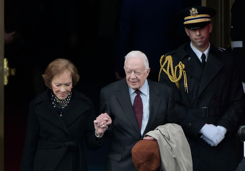 In this file photo taken on Jan 20, 2017, former US President Jimmy Carter and his wife Rosalynn Carter step out of the US Capitol for the inauguration of US President-elect Donald Trump in Washington, DC. — AFP