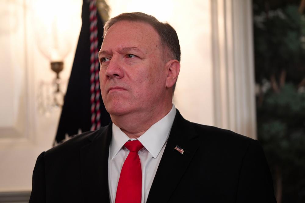 In this file photo taken on Oct 23, 2019, US Secretary of State Mike Pompeo listens as US President Donald Trump speaks about Syria in the Diplomatic Reception Room at the White House in Washington, DC. — AFP