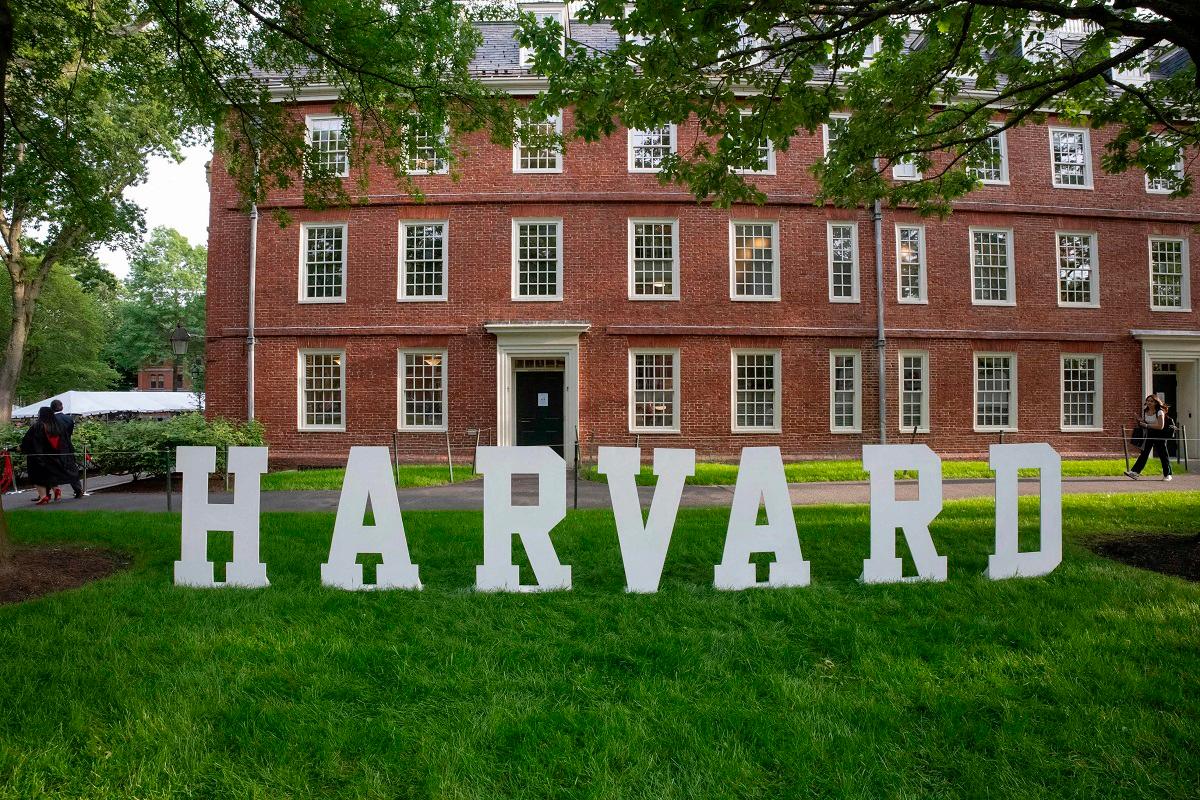 A Harvard sign is seen at the Harvard University campus in Boston, Massachusetts, on May 27, 2025. US President Donald Trump on June 4, 2025 announced a ban on visas for foreign students who are set to begin attending Harvard University, ramping up his administration’s crackdown on higher education. - Rick Friedman / AFP