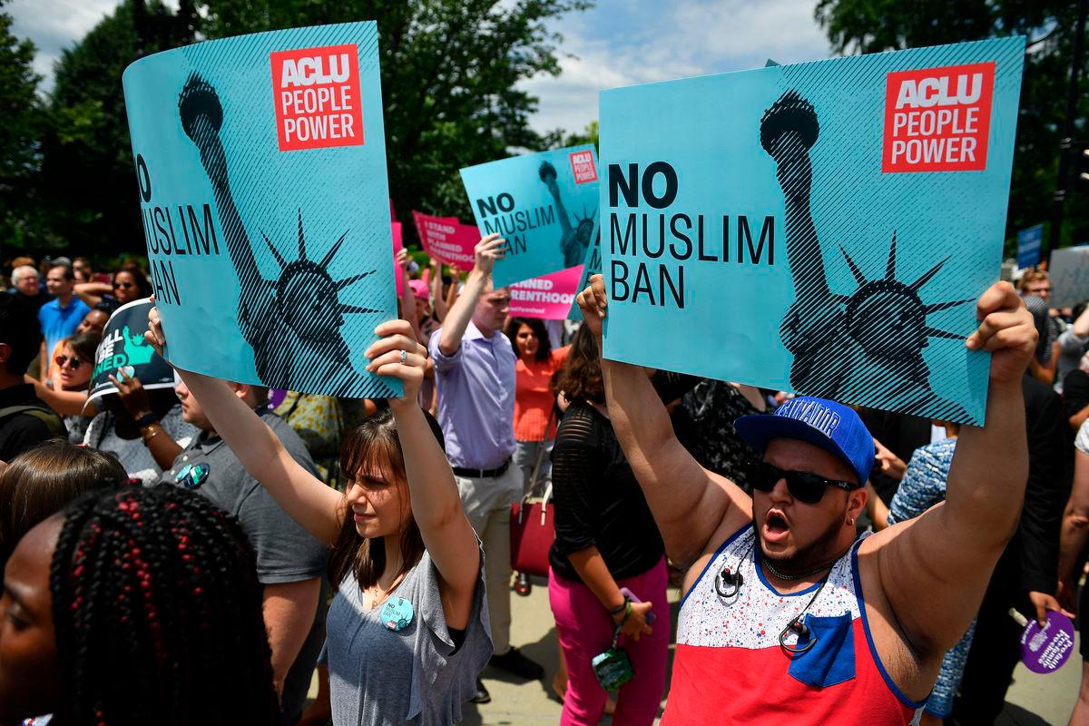 FILEpix: People protest the Muslim travel ban in front of the US Supreme Court in Washington, DC on June 26, 2018. US President Donald Trump signed a new travel ban June 4, 2025 targeting 12 countries, saying it was spurred by an attack on a Jewish protest in Colorado that authorities blamed on a man they said was in the country illegall. AFP