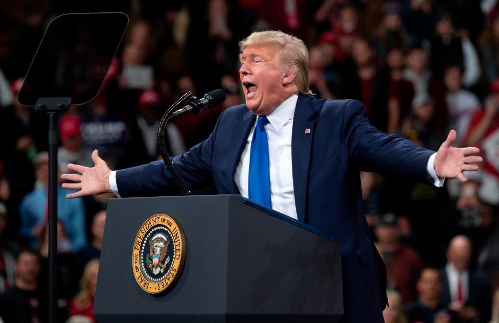 In this file photo taken on Jan 14, US President Donald Trump gestures as he speaks during a Keep America Great campaign rally in Milwaukee, Wisconsin. — AFP