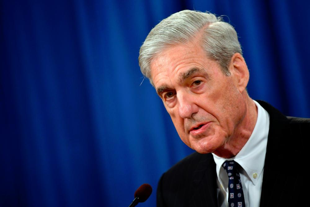 Special Counsel Robert Mueller speaks on the investigation into Russian interference in the 2016 Presidential election, at the US Justice Department in Washington, DC. — AFP