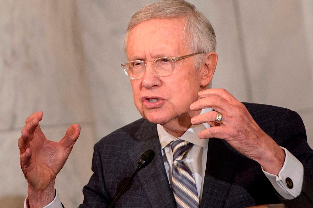 (FILES) In this file photo taken on December 8, 2016 US Senate Minority Leader Senator Harry Reid (D-NV) speaks during his portrait unveiling on Capitol Hill in Washington, DC. Harry Reid, former Senate majority leader died, he was 82 years old. AFPPIX