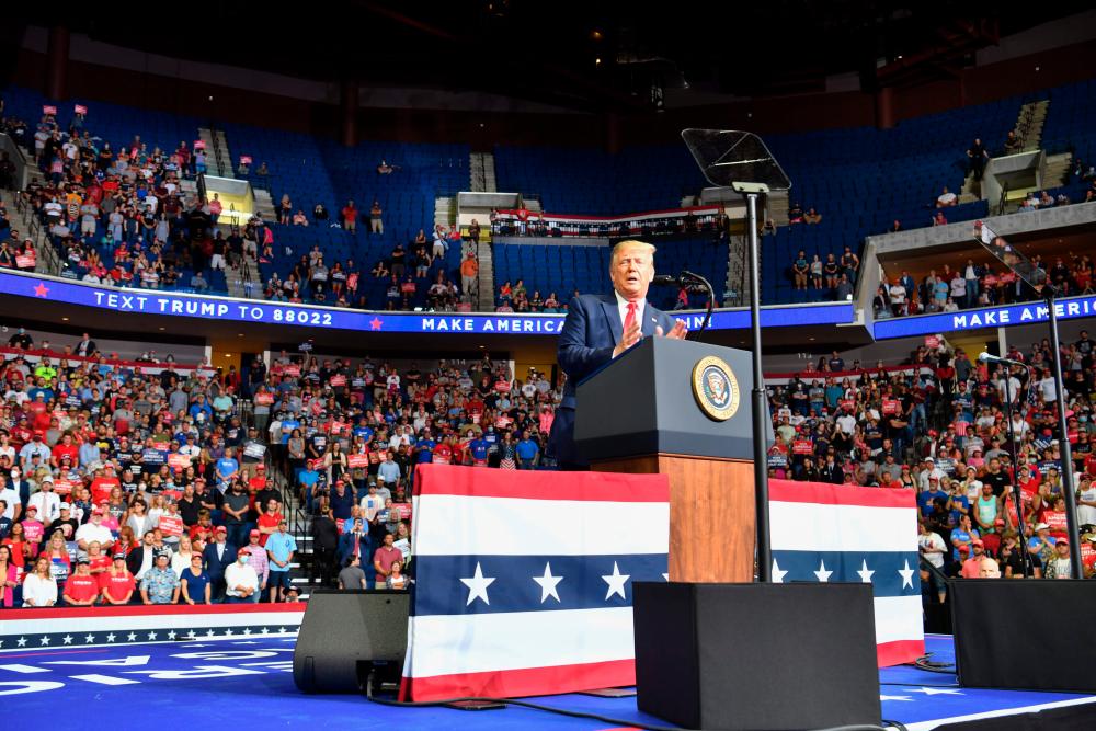 In this file photo taken on June 20, 2020 The upper section is seen partially empty as US President Donald Trump speaks during a campaign rally at the BOK Center on June 20, 2020 in Tulsa, Oklahoma. — AFP