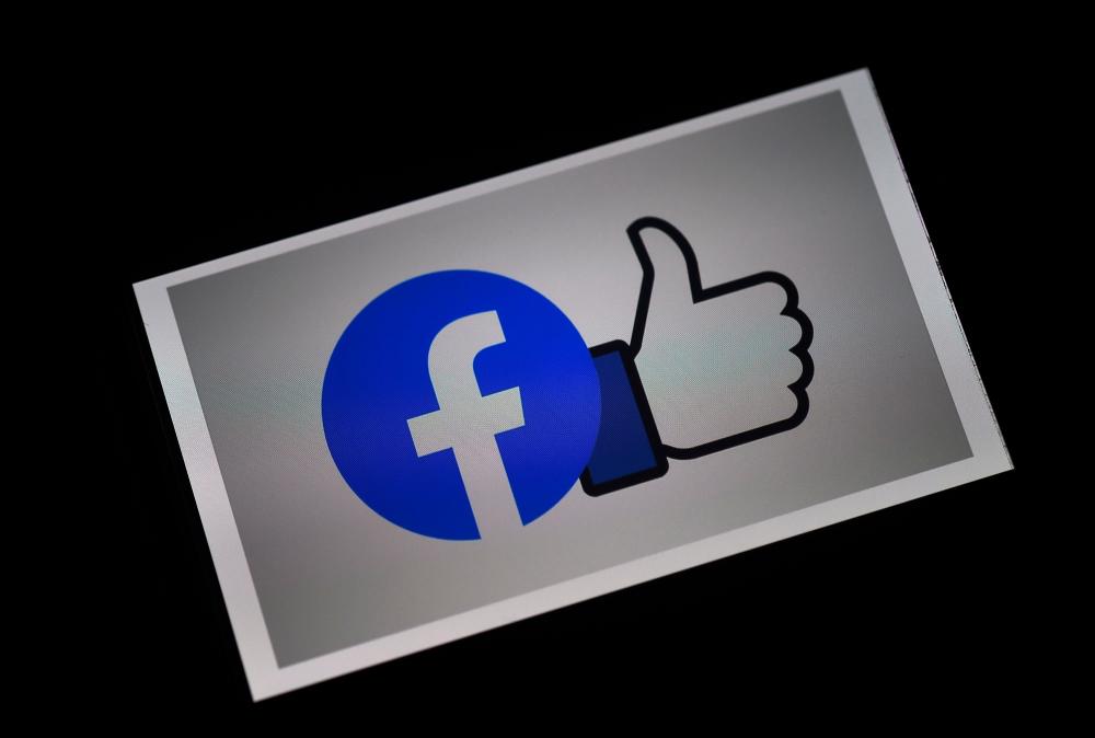 In this file photo illustration a Facebook App logo is displayed on a smartphone on March 25, 2020 in Arlington, Virginia. — AFP