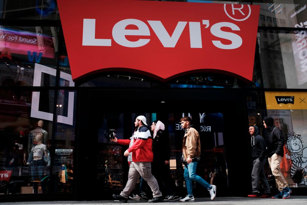 People walk by a Manhattan Levi's clothing store on March 19, 2019 in New York City - AFPPIX