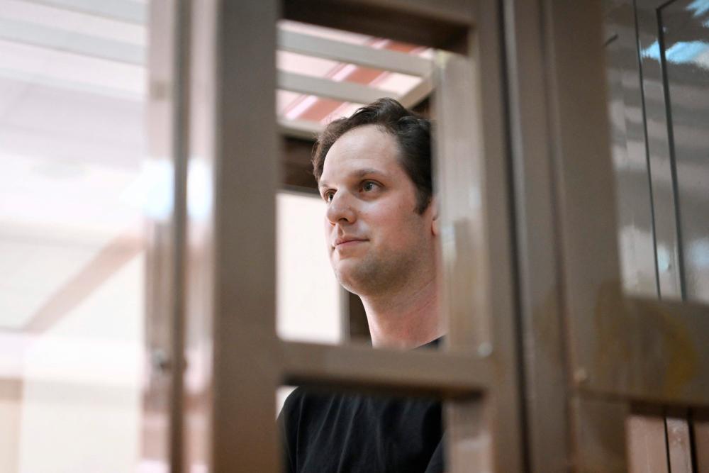 US journalist Evan Gershkovich, arrested on espionage charges, stands inside a defendants’ cage before a hearing to consider an appeal on his extended detention at The Moscow City Court in Moscow on June 22, 2023. AFPPIX