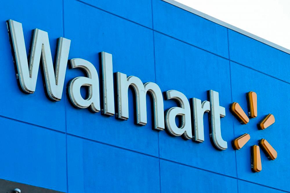 (FILES) In this file photo taken on August 15, 2022 the Walmart logo is seen outside a Walmart store in Burbank, California/AFPPIX