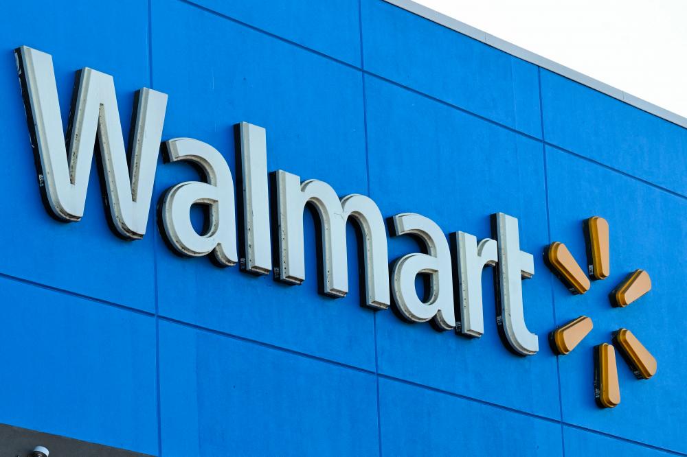 (FILES) In this file photo taken on August 15, 2022 the Walmart logo is seen outside a Walmart store in Burbank, California. - AFPPIX