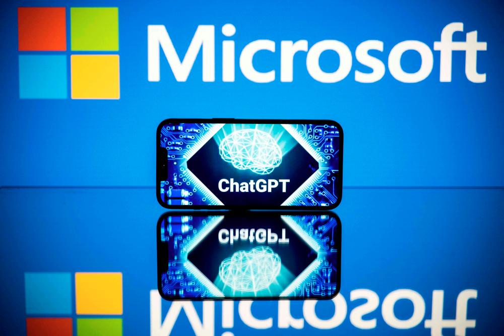 Screens displaying the logos of Microsoft and ChatGPT, a conversational artificial intelligence application software developed by OpenAI. – AFPpic