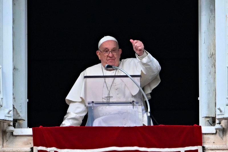 Pope Francis gestures to the crowd from the window of the Apostolic Palace overlooking St Peter’s Square during the Epiphany Angelus prayer, in the Vatican, on January 6, 2025. - AFPpix