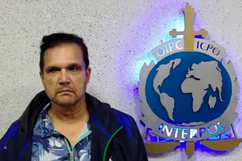 Undated handout picture released on September 21, 2022 by the Instagram account of Interpol Venezuela shows Malaysian fugitive Francis Leonard Glenn, known as “Fat Leonard”, after his capture in Maiquetia, Venezuela. AFPpix