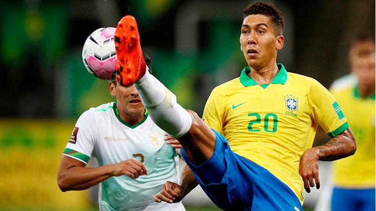 Brazil’s Roberto Firmino (right) vie for the ball during their 2022 FIFA World Cup South American qualifier match at the Neo Quimica Arena in Sao Paulo, Brazil. – AFPPIX
