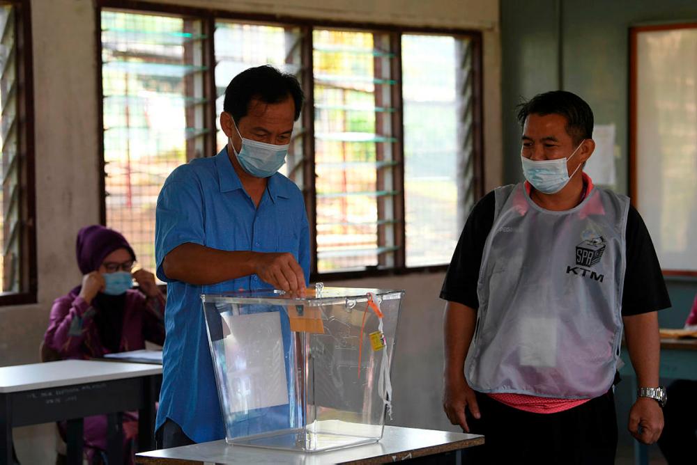 Ahmad Alok, 48, among the earliest voter to vote in Sabah election this morning.-Bernama