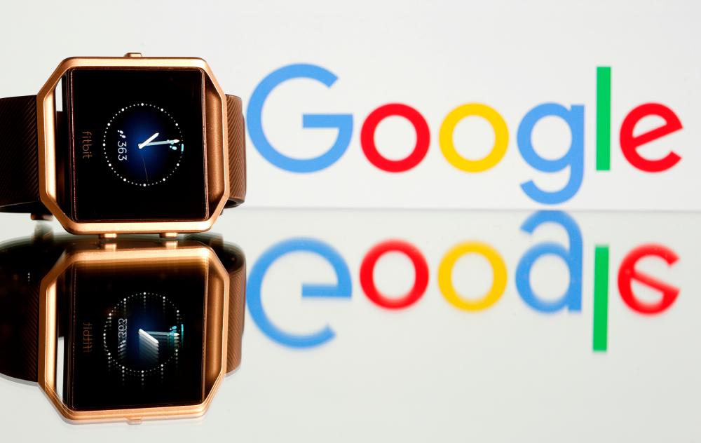 Fitbit Blaze watch is seen in front of a displayed Google logo in this illustration picture. – REUTERSPIX