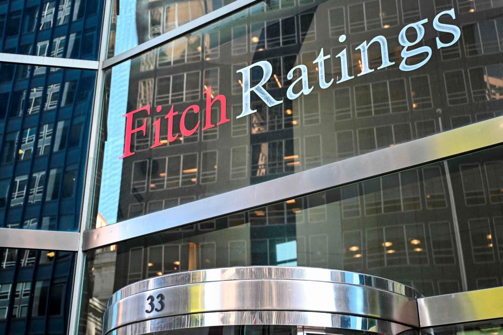 Fitch Ratings believes the global trade war will reduce US growth, push up US inflation and delay US Federal Reserve rate cuts. – AFPpic