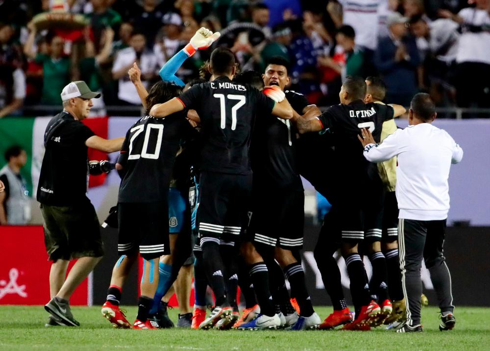 Mexico celebrates after beating the United States 1-0 in the 2019 CONCACAF Gold Cup Final at Soldier Field on July 07, 2019 in Chicago, Illinois. — AFP