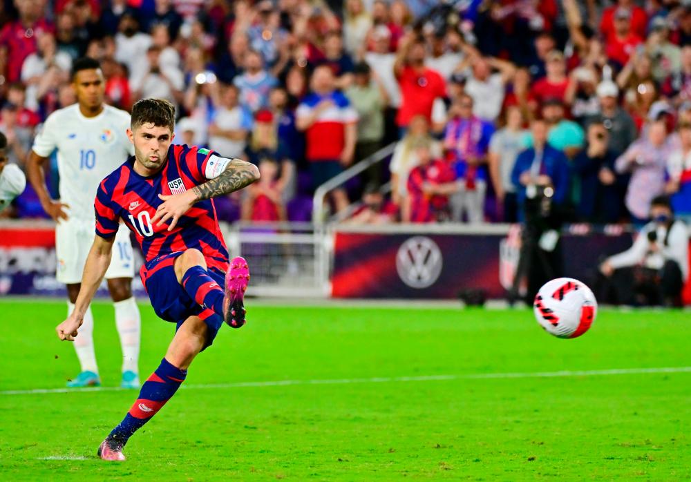 Christian Pulisic #10 of the United States shoots a goal on a penalty kick in the first half against Panama at Exploria Stadium on March 27, 2022 in Orlando, Florida. AFPPIX