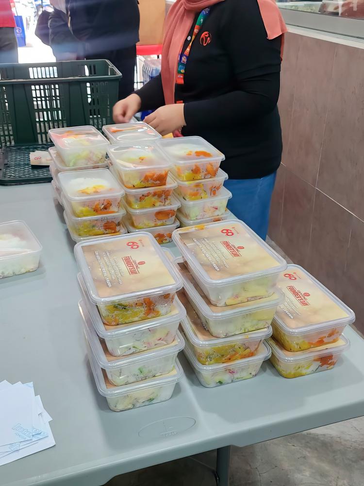 $!Food packs being stacked and organised before distribution in Pudu, Kuala Lumpur.