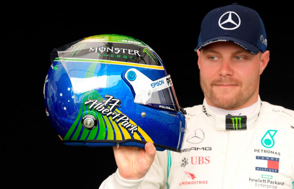 Mercedes' Valtteri Bottas poses for a drivers portrait. - Reuters