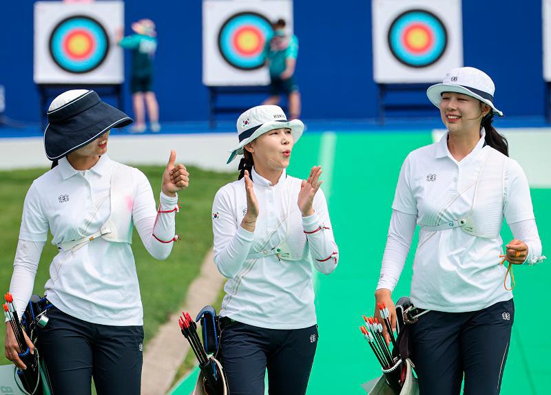 $!South Korean archer, Lim Sihyeon (right) is celebrated by her teammates Nam Suhyeon and Jeon Hunyoung after competing in the Women’s archery event at the Paris 2024 Olympic Games at the Esplanade Des Invalides today.